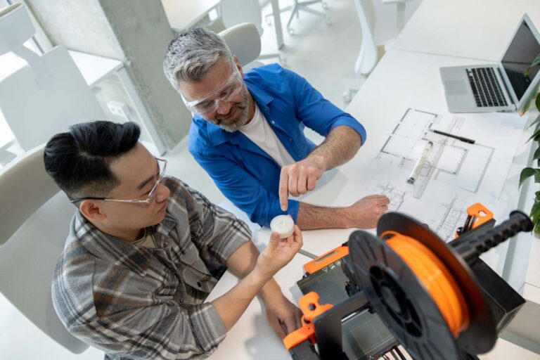 scientists-involved-setting-up-developing-3d-printers-modern-laboratory-e1744010082144-768x512
